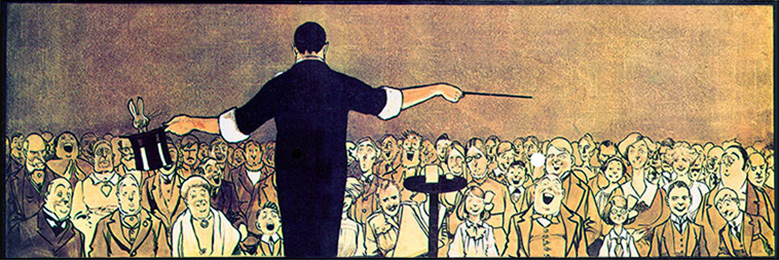 Magician in front of audience in early 1900's.