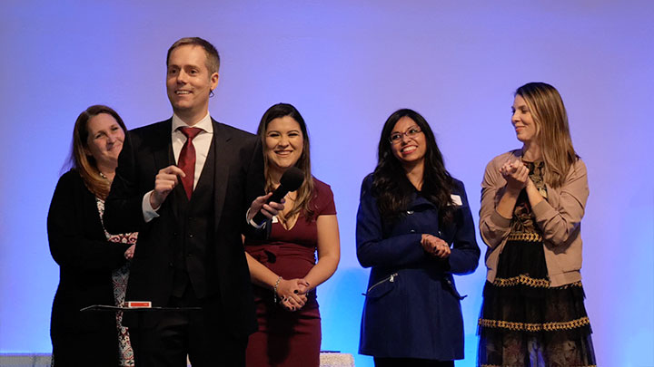 Joe Skilton reads the minds of four employees on stage.