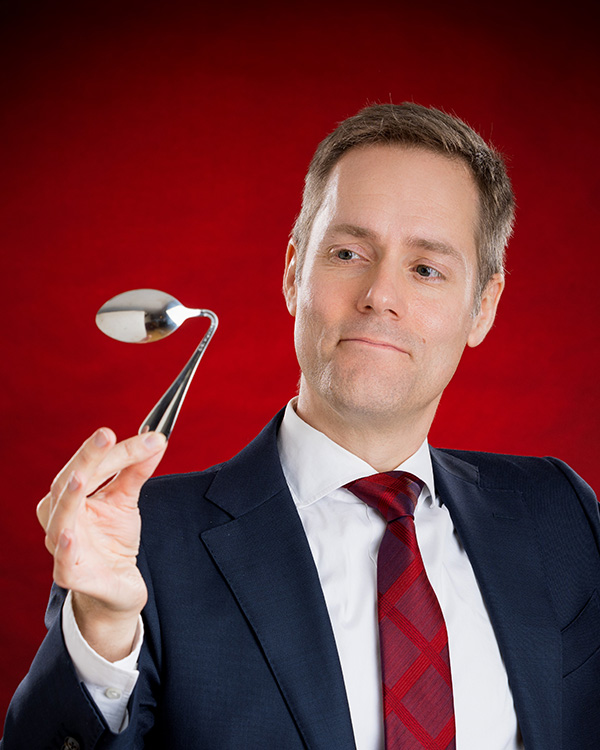 Mentalist Joe Skilton bends a spoon.