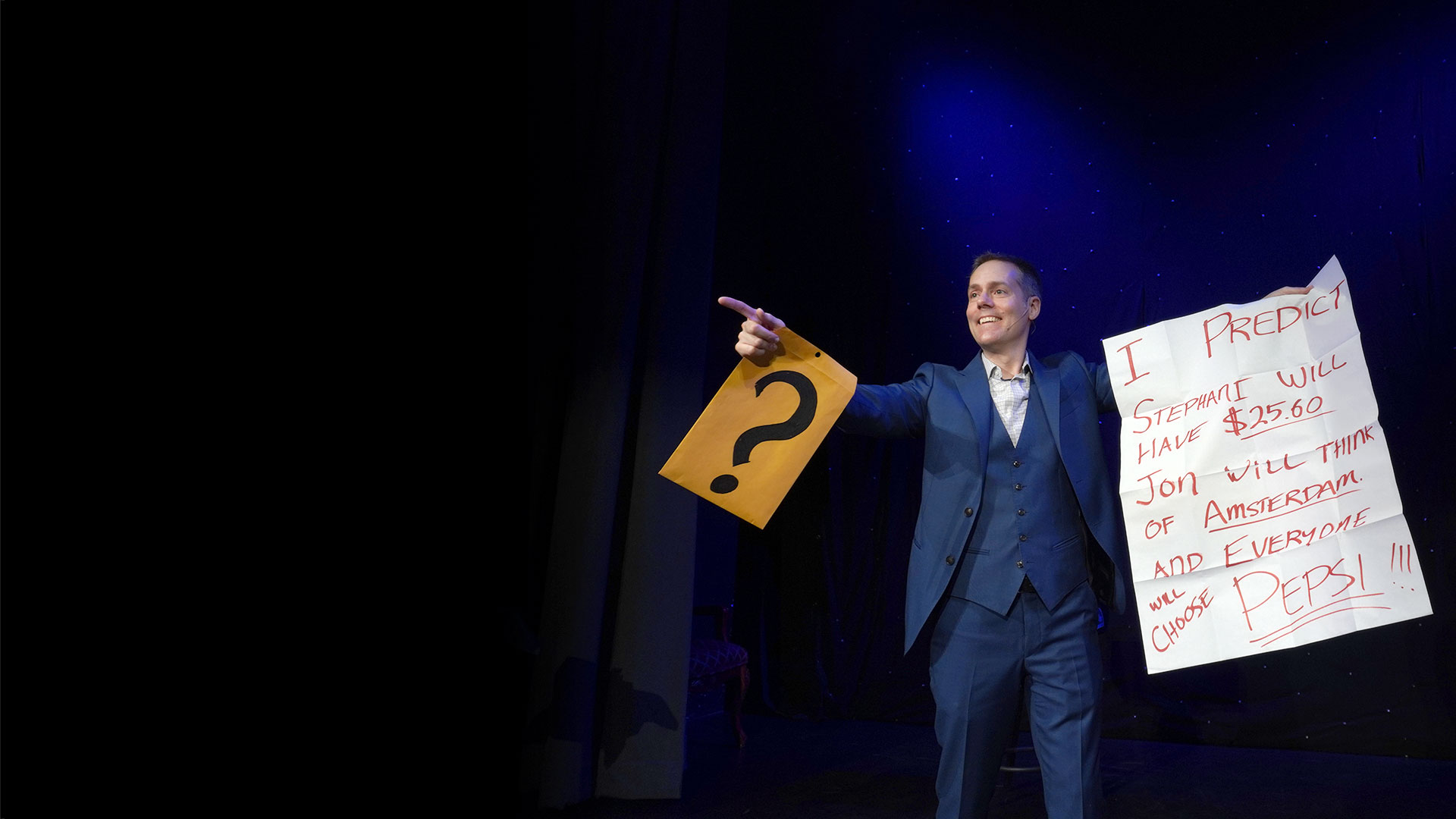 Corporate mentalist Joe Skilton reveals a prediction on stage.