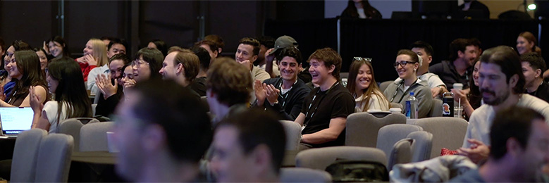 Sales kickoff audience laughs and applauds mentalist Joe Skilton
